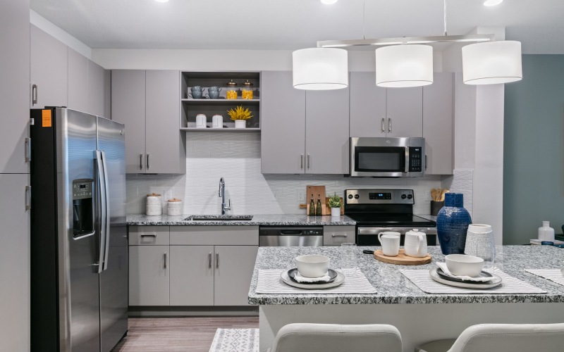 Kitchen Interior with Steel Appliances & Granite Counters